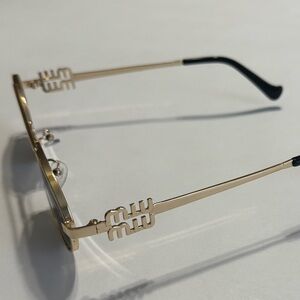 Gold Oval Sunglasses with Black Lenses
